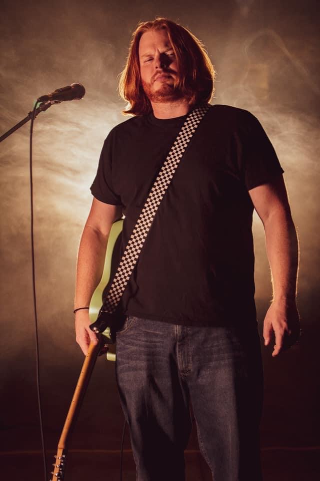 Brandon Dougherty is the lead singer and rhythm guitarist for INDYCA